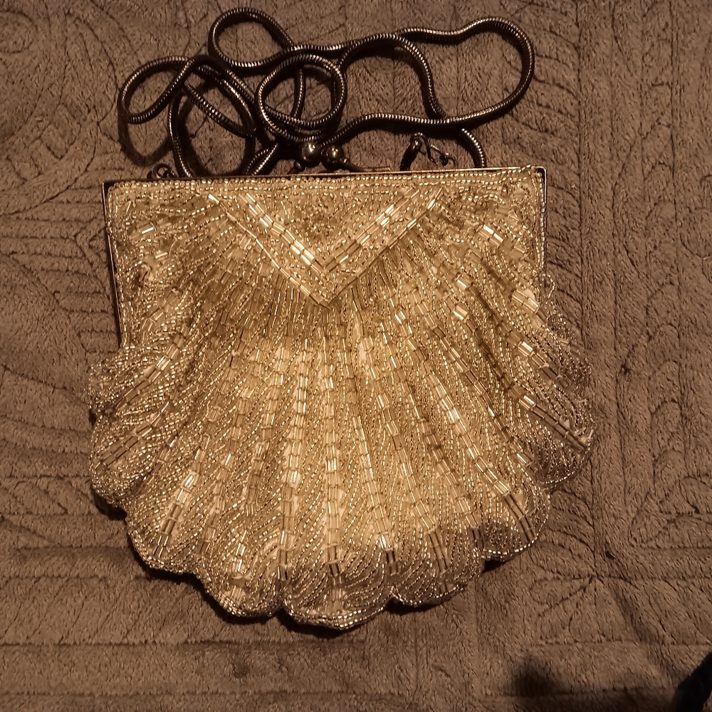 Off white beaded evening bad with strap.